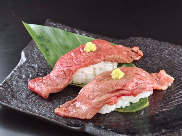 A photo of Beef aburi sushi