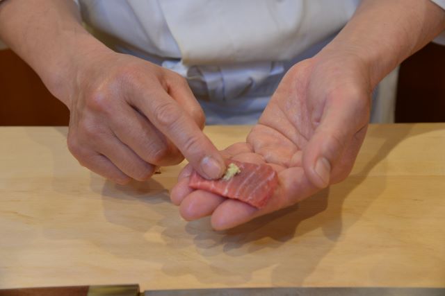 a photo of making nigiri sushi