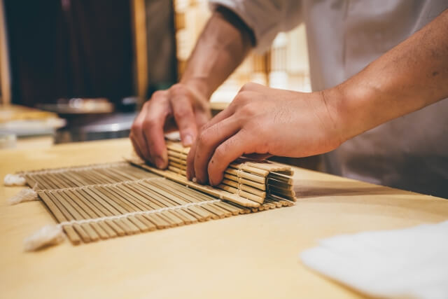 a photo of making sushi roll