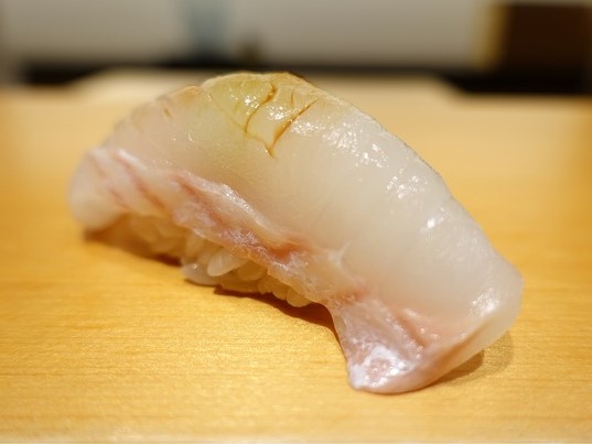 A photo of Spotted halibut (Hoshigarei) nigiri