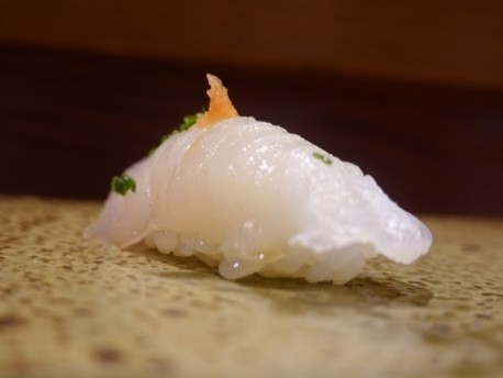 A photo of Unicorn leatherjacket (Usubahagi) nigiri sushi