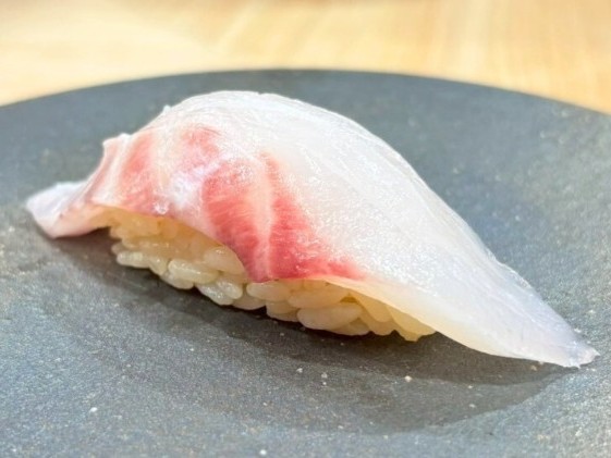 A photo of Painted sweetlip (Korodai) nigiri sushi