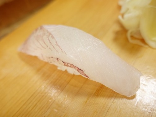 A photo of Striped boarfish (Tengudai) nigiri sushi