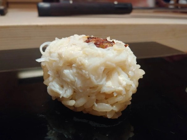 a photo of Helmet crab (Kurigani) nigiri sushi
