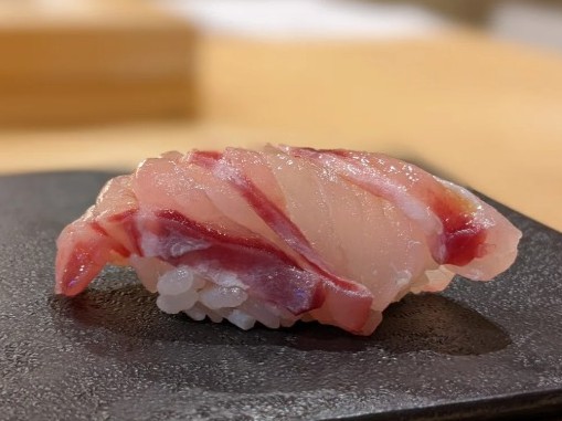 A photo of Malabar grouper (Yaitohata) nigiri sushi