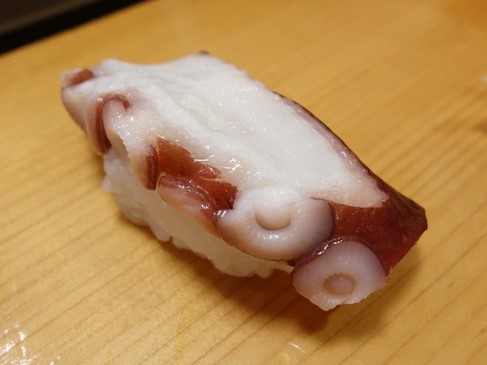 a photo of Chestnut octopus (Yanagidako) nigiri