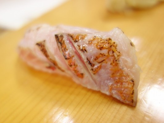 A photo of Yellowsail red bass (Shikishimahanadai) nigiri