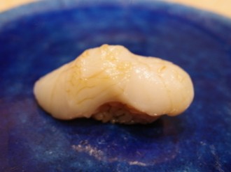 A photo of Japanese moon scallop (Tsukihigai) nigiri