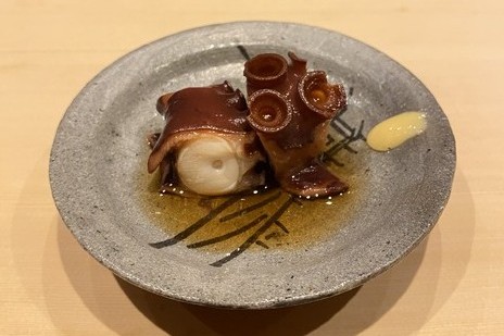 A photo of Soft simmered octopus