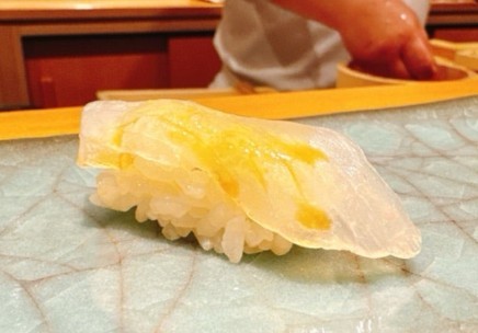A photo of Japanese bigeye (Kurumadai) nigiri sushi