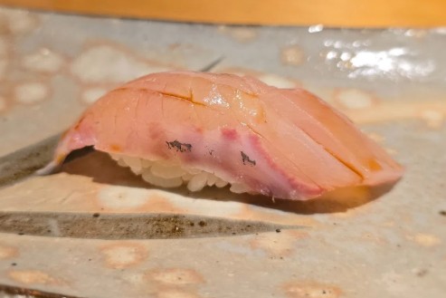 A photo of Whitemouth Jack (Okiaji) nigiri sushi