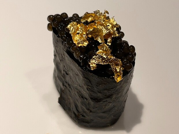 A photo of Caviar gunkan-maki topped with gold leaf