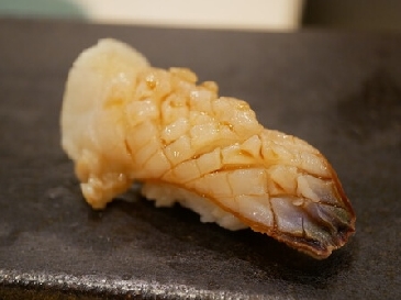 A photo of mirugai nigiri sushi