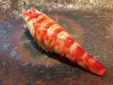A photo of kuruma ebi nigiri sushi
