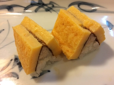 A photo of tamagoyaki nigiri sushi