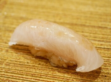 A photo of kanpachi nigiri sushi