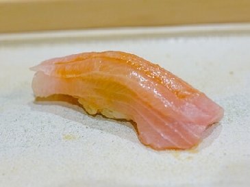 A photo of buri nigiri sushi