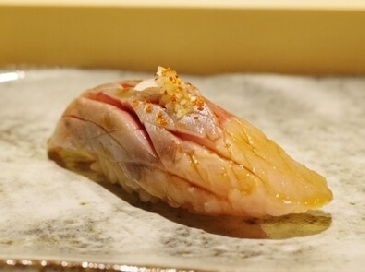 A photo of Nishin nigiri sushi