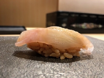 A photo of Ainame nigiri