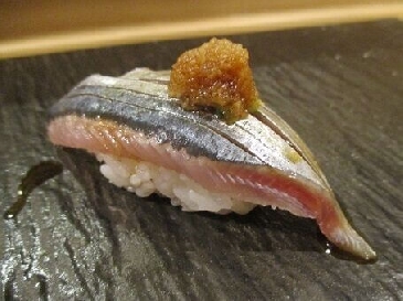 A photo of sanma nigiri sushi