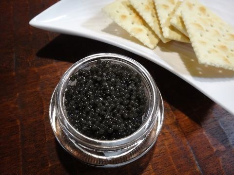 an image of caviar on the cracker 