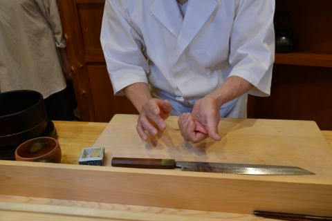 a photo of sushi chef 
