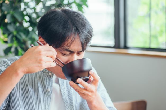 a photo of eating soup