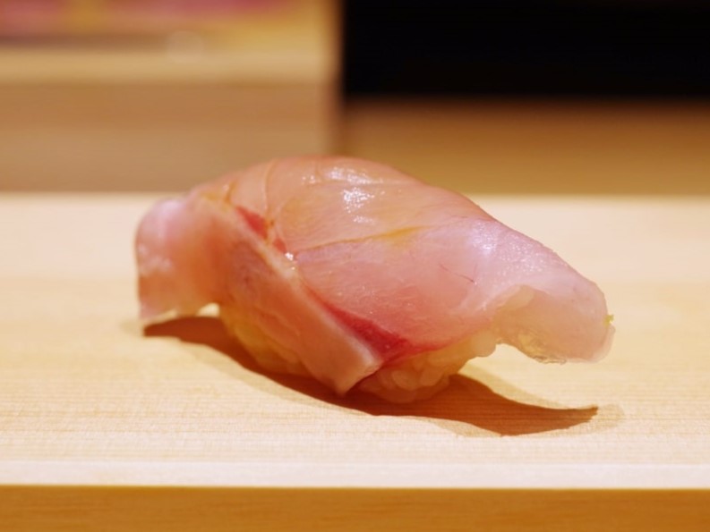 a photo of Kuromutsu nigiri sushi