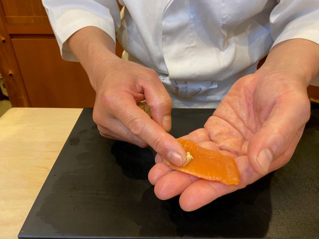 a photo of making nigiri sushi