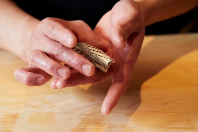 A photo of making nigiri sushi
