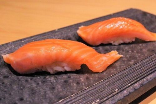 A photo of Cherry Salmon (Sakura Masu) nigiri