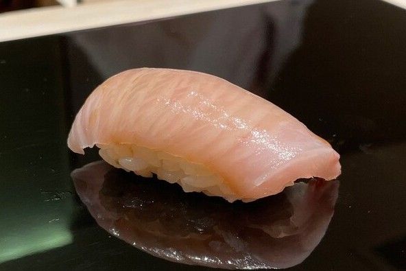 A photo of kanpachi nigiri